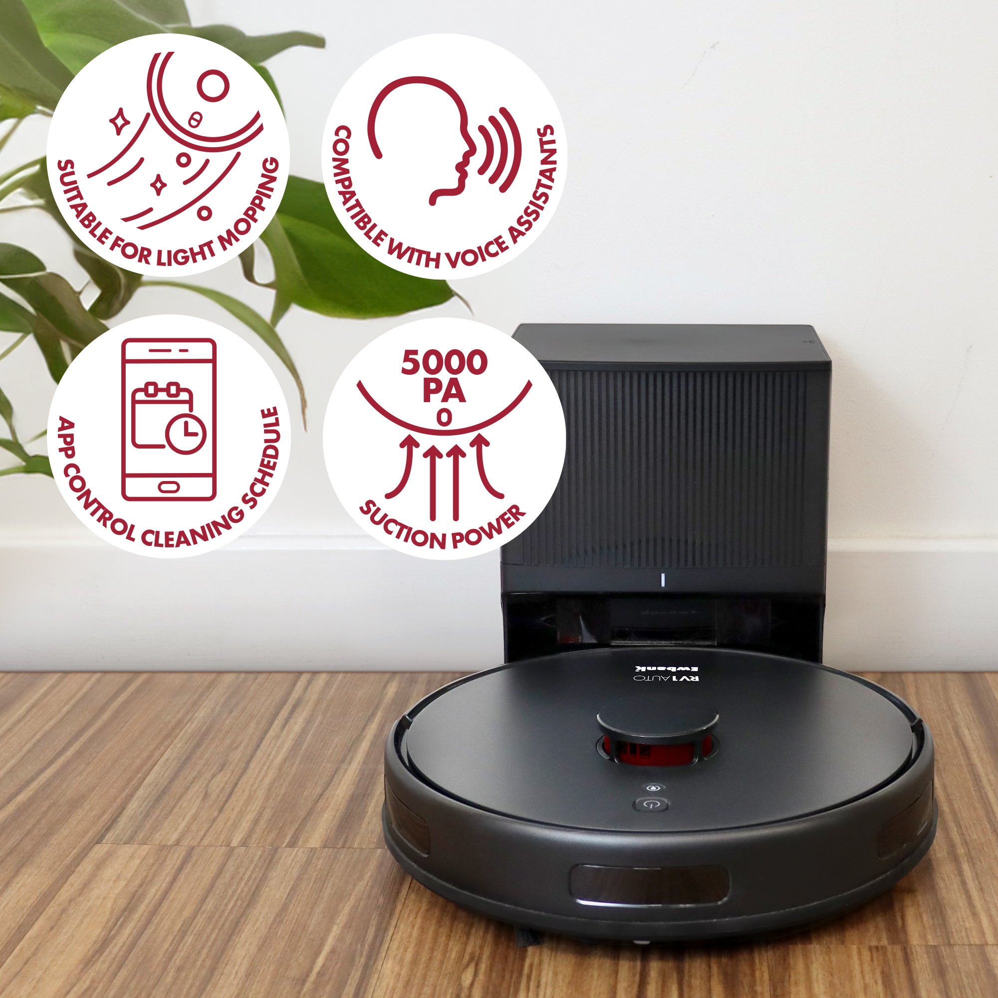 The Ewbank EWVC04604 RV1AUTO Robot Vacuum with Auto-Empty Station docks on a wooden floor. Icons show LiDAR navigation, light mopping, voice assistant support, and 5000 Pa suction. A plant is visible in the background.