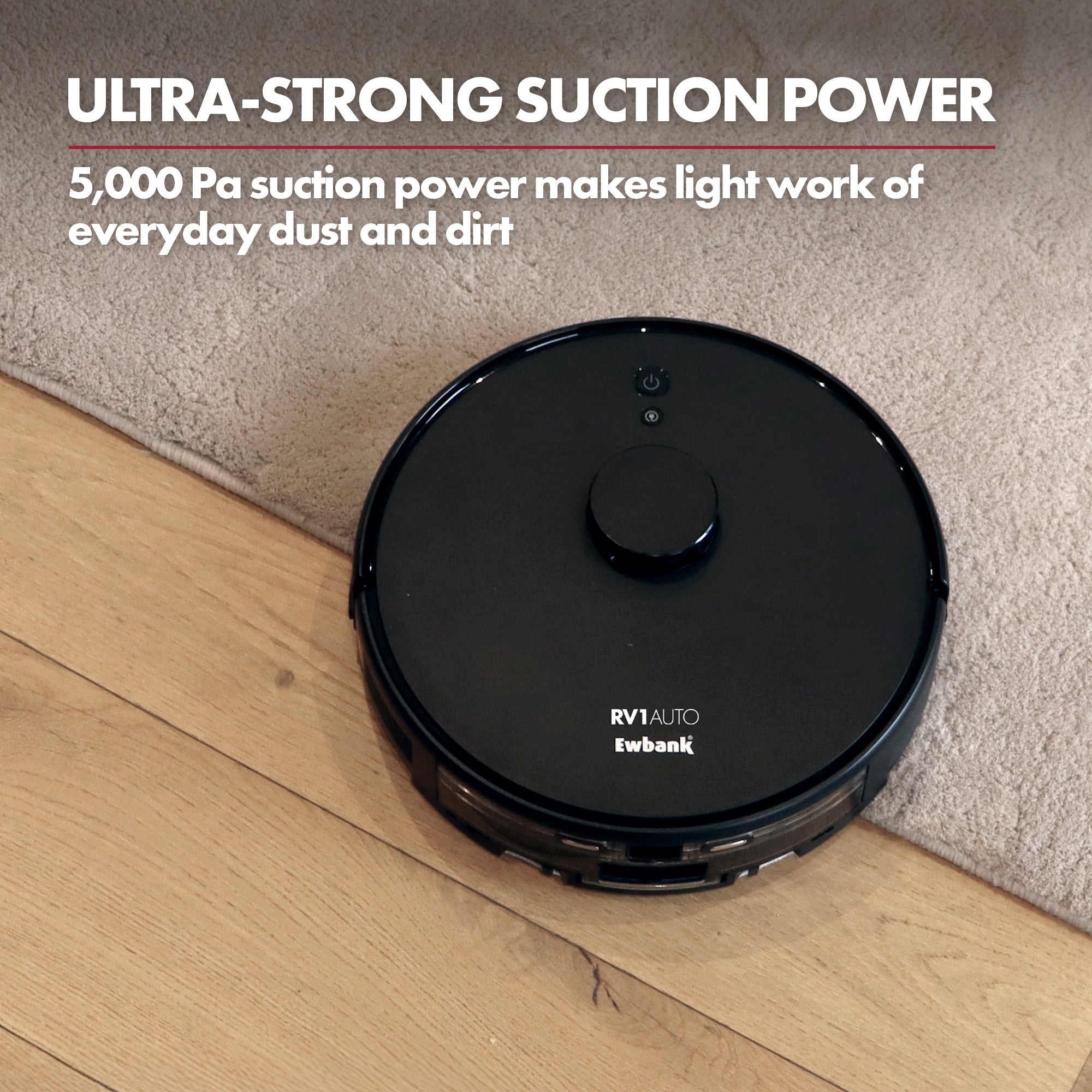 A black Ewbank EWVC04604 RV1AUTO Robot Vacuum with Auto-Empty Station cleans the edge of a carpet and wooden floor. Text above reads: ULTRA-STRONG SUCTION POWER. With LiDAR navigation and 5,000 Pa suction, cleaning is effortless.