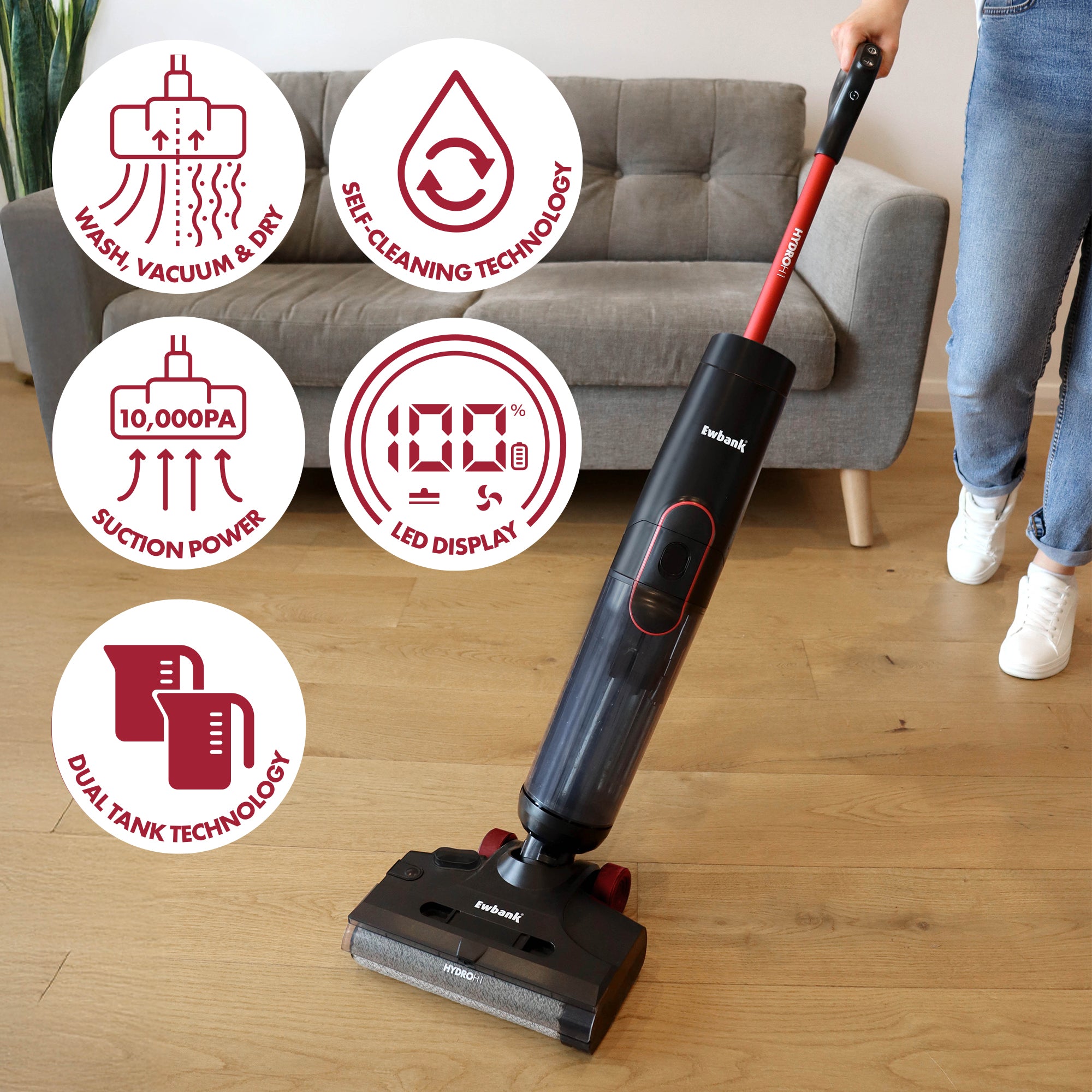 A person uses the HYDROH1 Cordless Hard Floor Cleaner, a 2-in-1 wet & dry vacuum, on hardwood. Icons highlight features: washes, vacuums & dries, self-cleaning, 10,000PA suction, LED display, and dual tank technology.