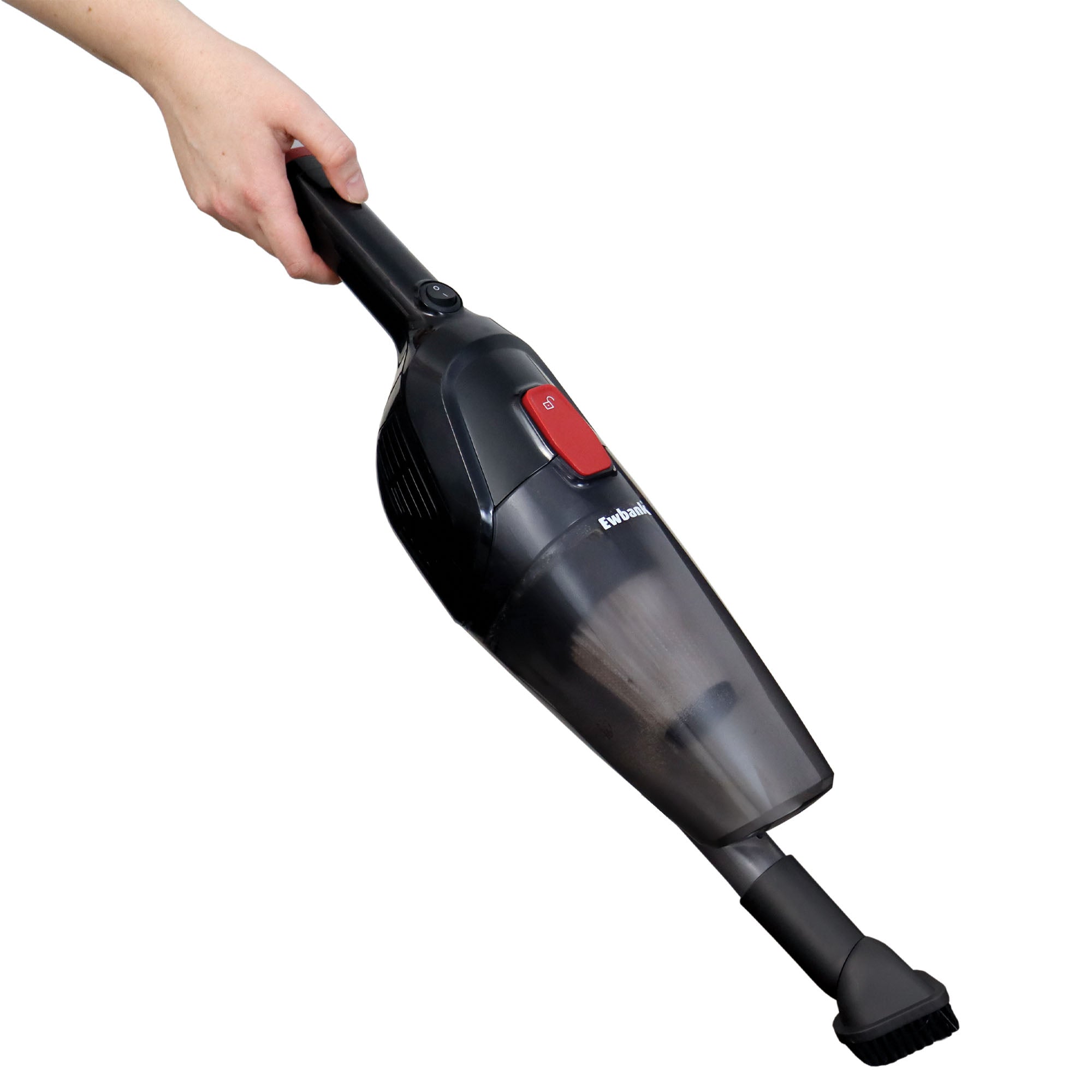 A hand holds the ACTIVE 2-in-1 Corded Stick Vacuum Cleaner in Red/Black, featuring a lightweight design, transparent dust container, and brush attachment at the nozzle.