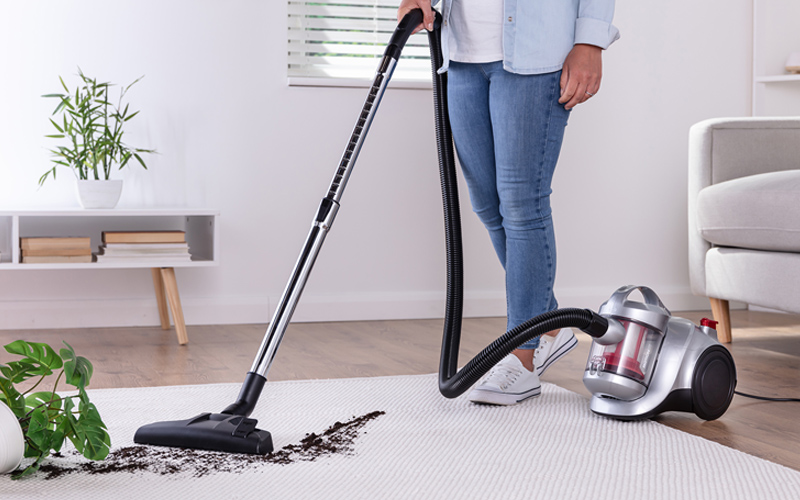 MOTION2 vacuum cleaning up soil on carpet